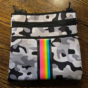 Haute Shore Peyton Crossbody bag. Gray camo with neon rainbow stripes.